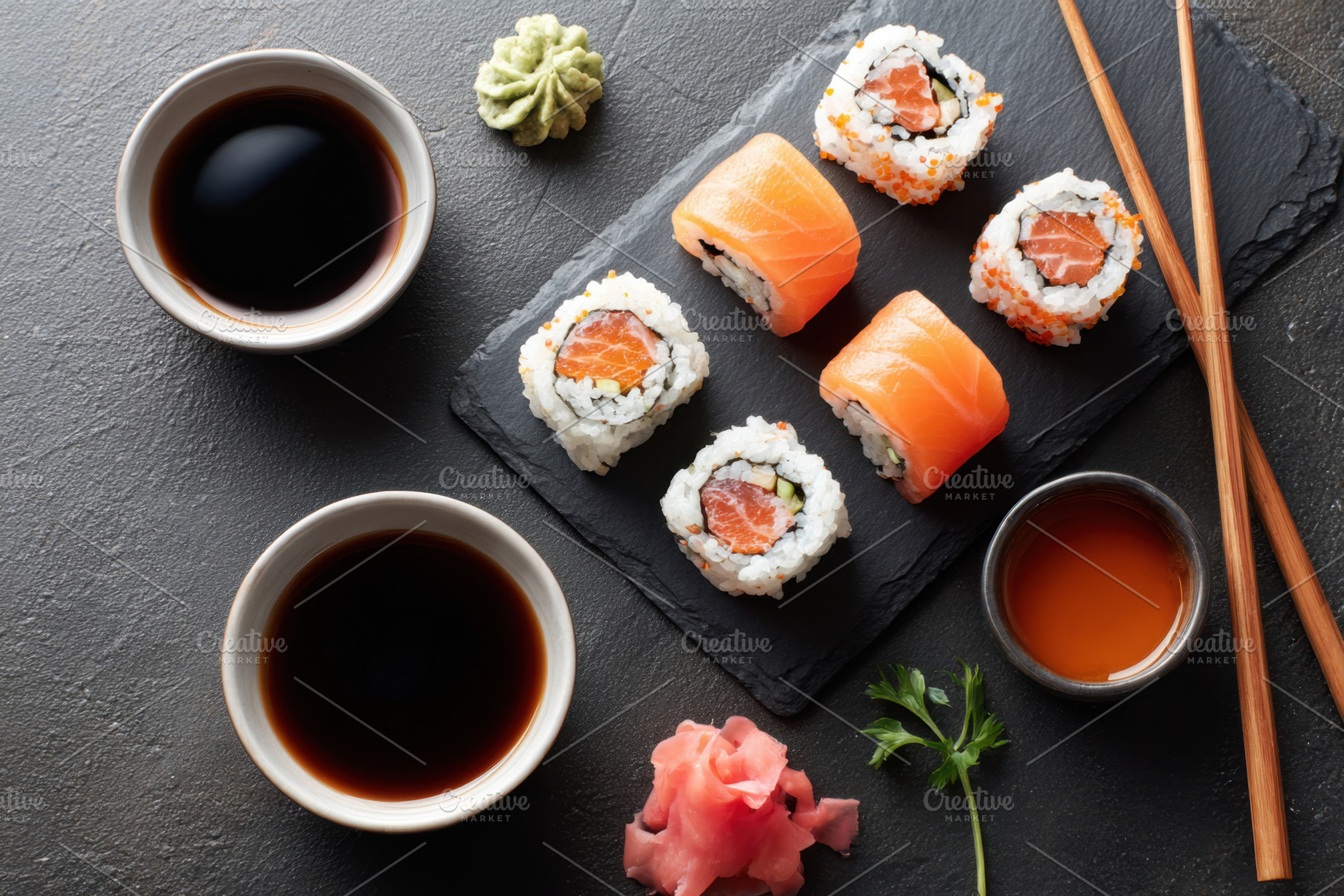 Delicious sushi platter with assorted rolls and sauces, a Food & Drink Photo by AlyaAnd