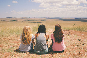 Three Girls Sitting in the Desert
