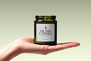 Candle Mockup on Hand, a Household Mockup by Design Squad (Thumbnail 2 of 4)