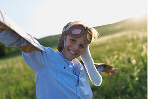 A small boy playing on a meadow in, a Person Photo by HalfPoint