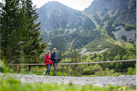 Active senior couple hiking together, a Nature Photo by HalfPoint