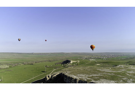 Hot air balloons in the sky over the, a Transportation Photo by Media Whale Stock