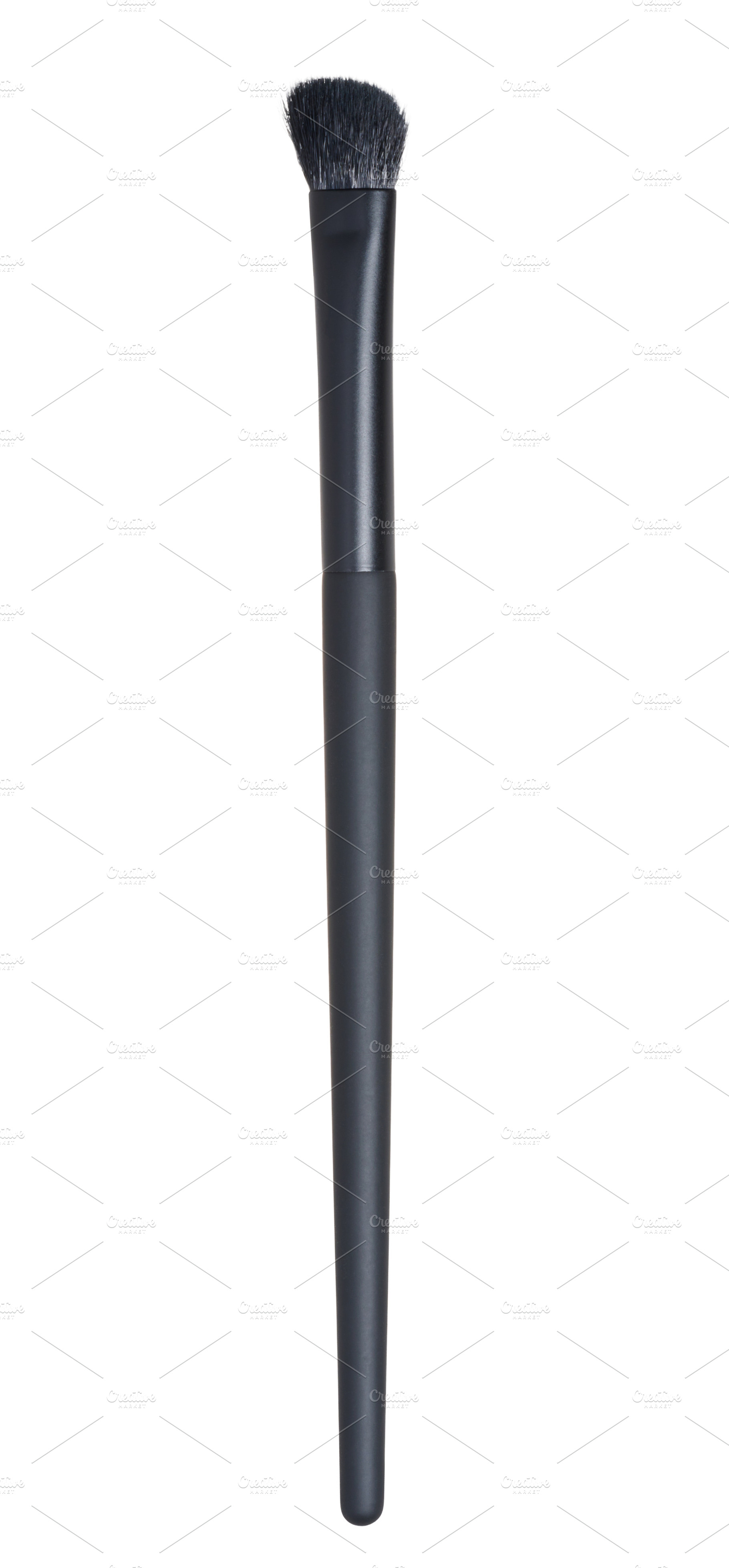 Thin black makeup brush on isolated background, a Beauty & Fashion Photo by ndanko