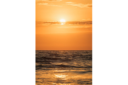 Ocean waves on sunset background, a Nature Photo by f9photos