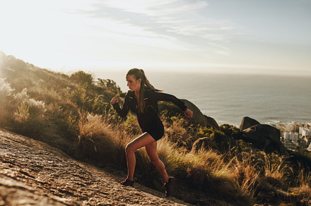 Fit woman running stock photo containing activity and athlete, a Sports & Recreation Photo by Jacob Lund