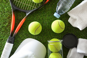 Tennis Equipment Arranged on Grass, a Sports & Recreation Photo by Davizro's Market