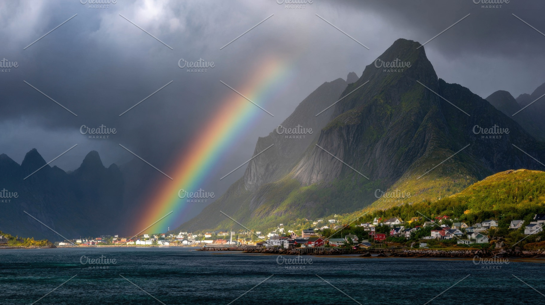 Colorful rainbow over a coastal town, a Photo by Beautiful things