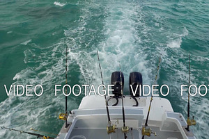 Motor boat with fishing tackles sailing in the ocean
