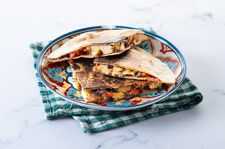 Mexican quesadilla with chicken, cheese and peppers isolated on, a Photo by etorres69