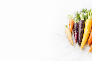 Rainbow carrots arranged on marble,, a Photo by Dvoevnore photos