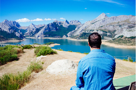 Young man sitting with his back to