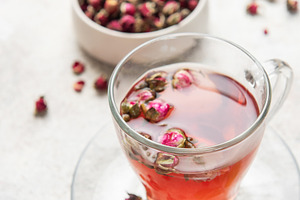 Pink rose herbal tea with dried buds and mint, a Food & Drink Photo by Olena Rudo