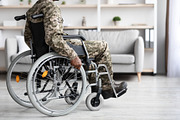 Cropped of black veteran in wheelchair rolling by home, a Photo by Prostock-Studio (Thumbnail 2 of 3)