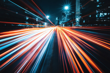 City lights create vibrant patterns, a Photo by Tanuart