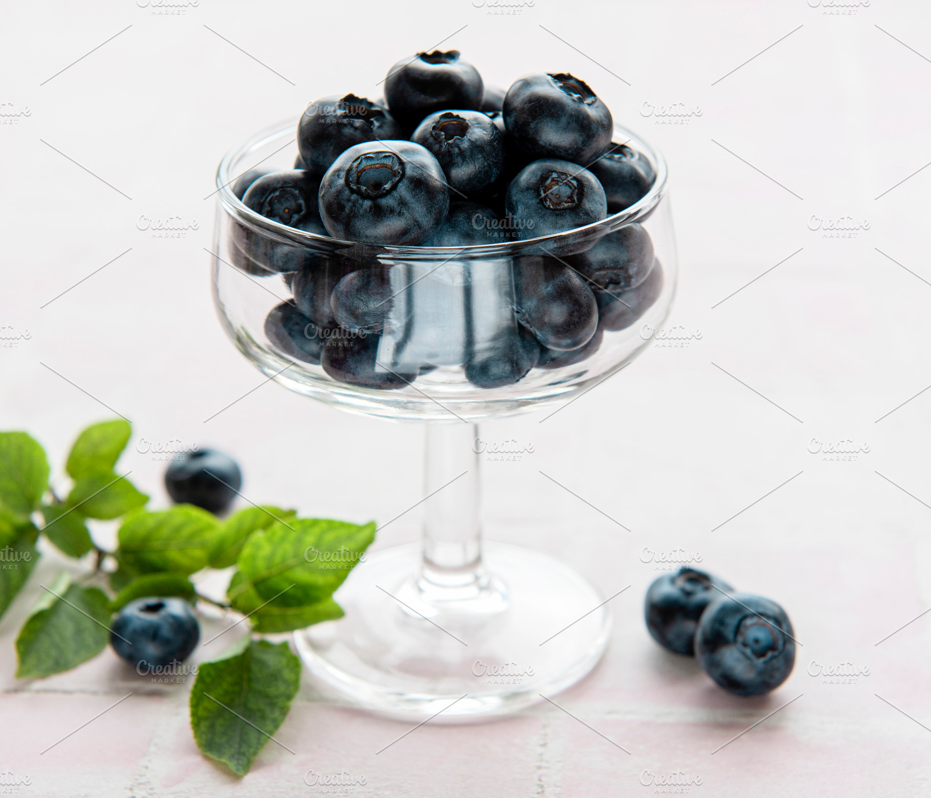 Blueberries on tile background, a Food & Drink Photo by Olena Rudo