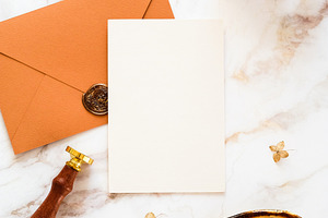 Autumn flat lay composition with wedding stationery set, blank paper card, gold