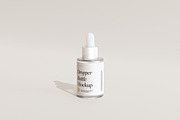 Frosted Glass Dropper Bottle Mockups, a Packaging Mockup by Wildfield Studio (Thumbnail 8 of 13)