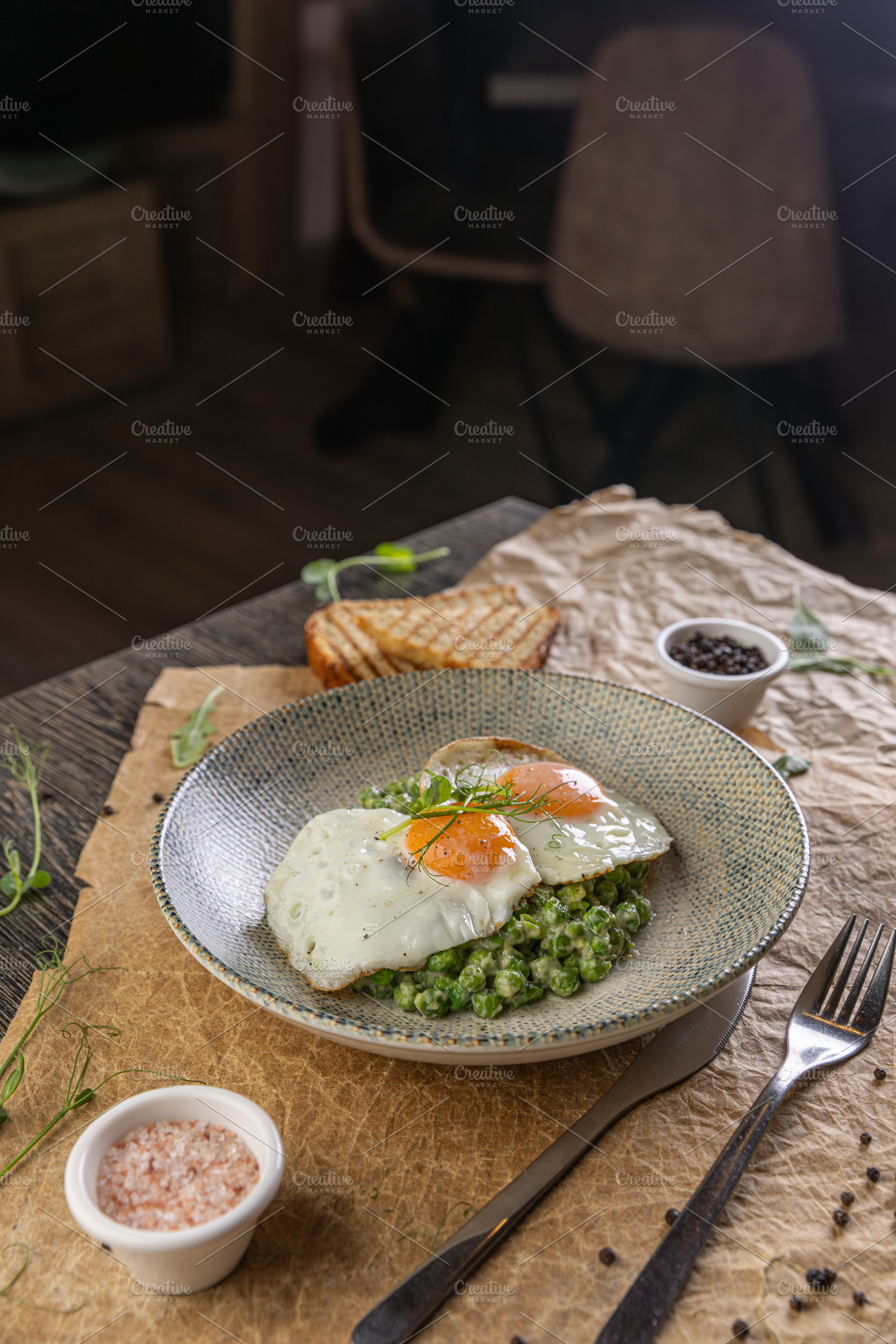Fried eggs with green peas puree, a Photo by Grafvision photography