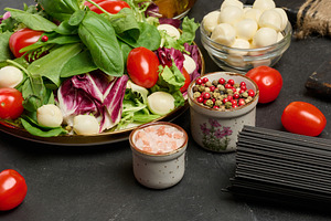 A plate of fresh salad with mixed greens, cherry tomatoes and mo, a Food & Drink Photo by ndanko
