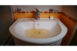 Running water in basin with yellow, a Nature Photo by Our Amazing World