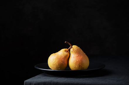 Fresh sweet pears on the dark background, a Food & Drink Photo by oxana.denezhkina