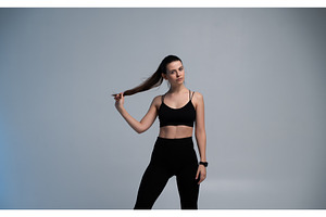 Young woman in black sportswear, a Sports & Recreation Photo by volodymyrshtun13795