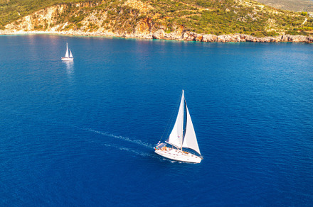Aerial view of beautiful yachts and boats on the sea at sunset, a Nature Photo by den-belitsky