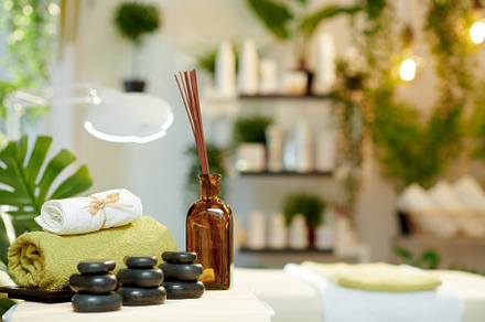 towels, hot stone massage, essential oils and massage table, a Health & Medical Photo by Alliance Images