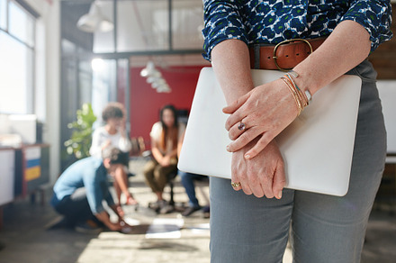 Businesswoman standing in her office stock photo containing adult and, a Business Photo by Jacob Lund