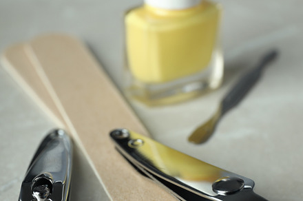 Concept of nail care with manicure accessories on light textured, a Beauty & Fashion Photo by AtlasStudio PRO