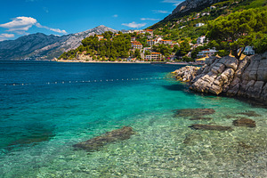 Amazing clean sea and gravelly beach, a Nature Photo by Alpine Dreams