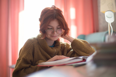 schoolgirl with glasses doing homework., a Photo by Pictures for you!!!!!!!!!