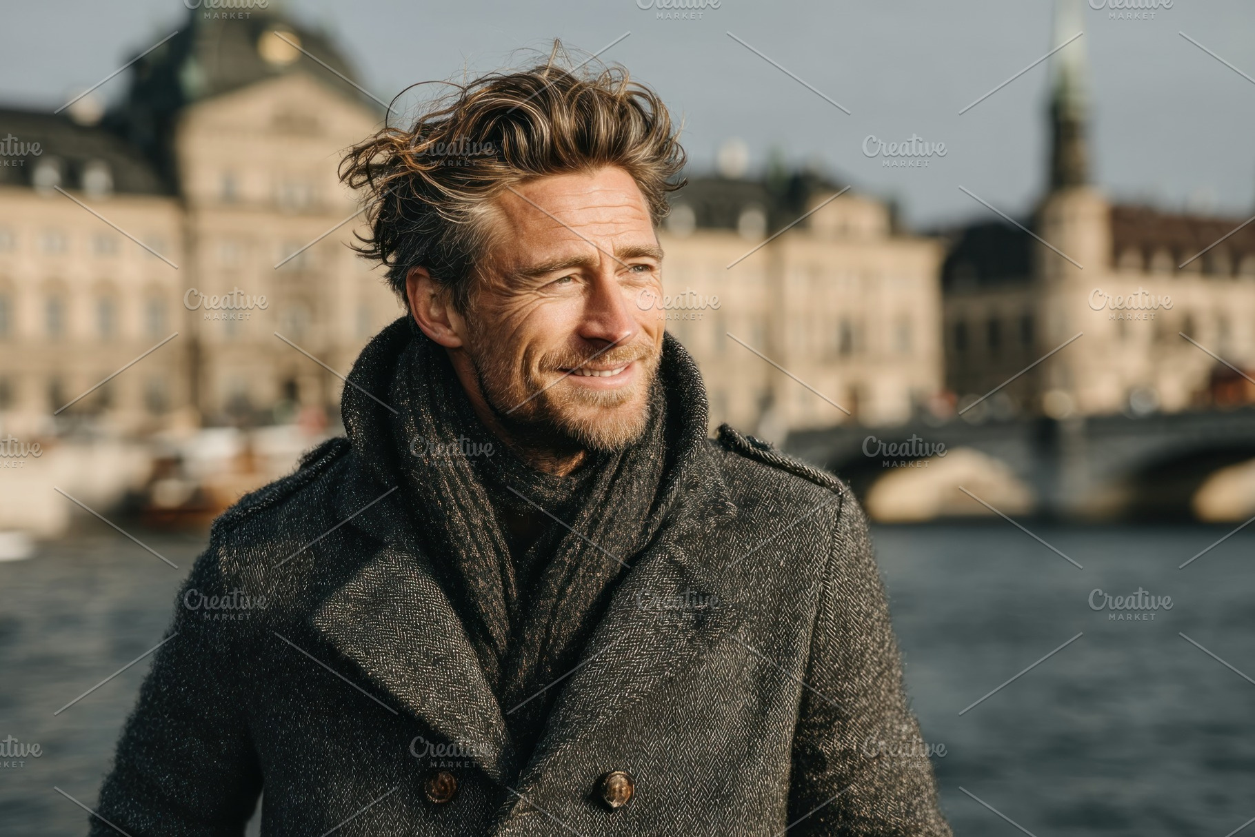 Smiling man with tousled hair in wool coat and scarf standing by, a Person Photo by José Manuel Gelpi