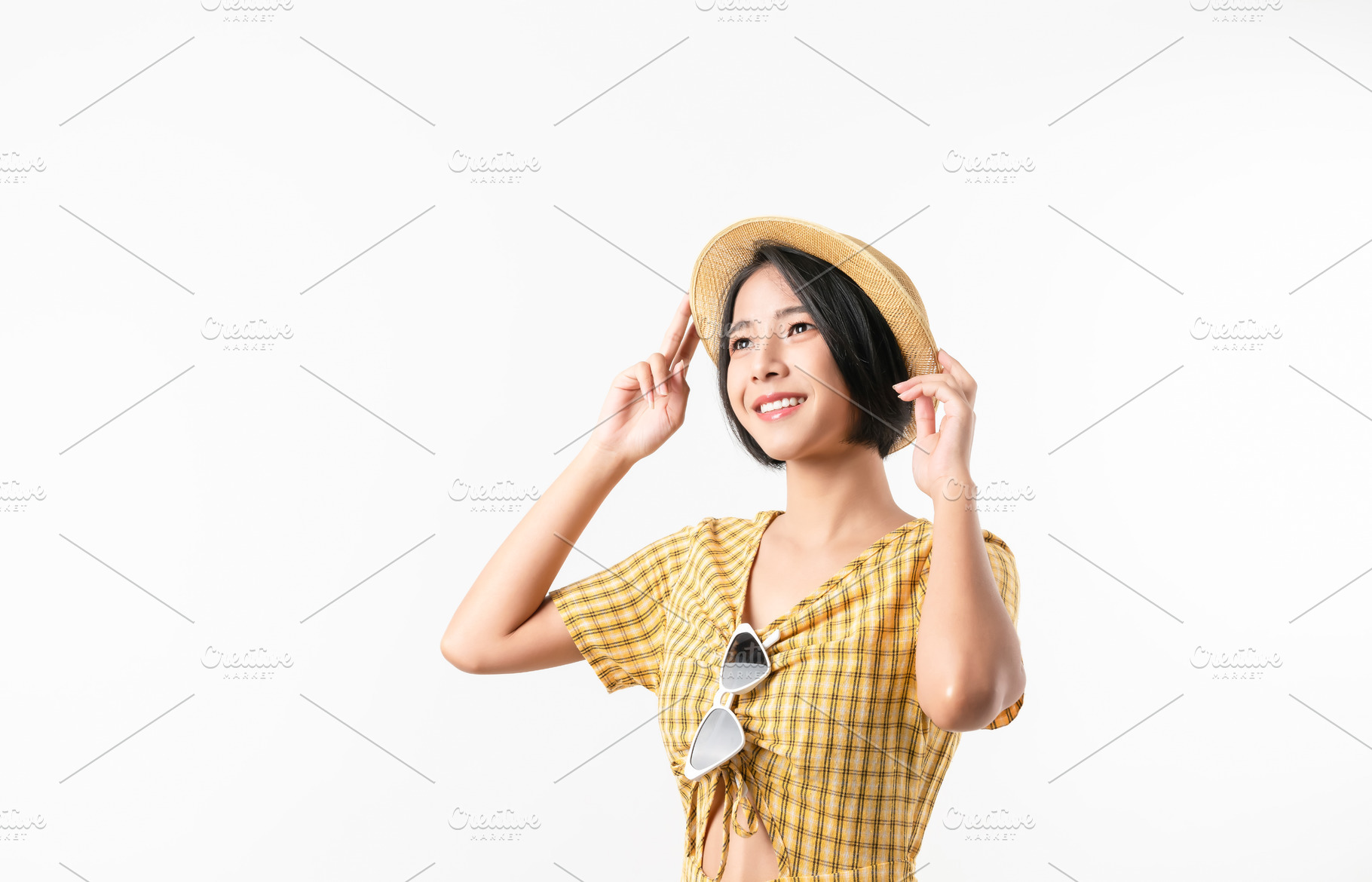 Studio shot of cheerful beautiful Asian woman in yellow color dress and wearing, a Person Photo by sitthiphong