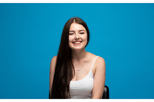 Smiling young woman showing, a Person Photo by volodymyrshtun13795