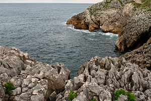 Rocky cliffs above the ocean with op, a Nature Photo by Perpis