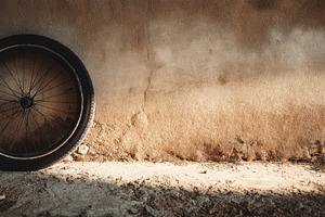 Bicycle Tire Against Wall in Summer, a Sports & Recreation Photo by Virgo Studio