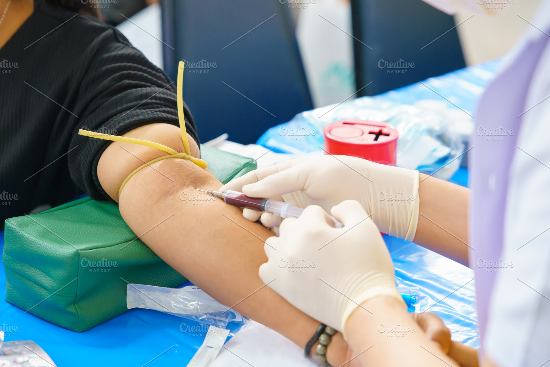 Close up hand collecting blood sample for diagnosis and treatmen, a Photo by Casanowe-studio