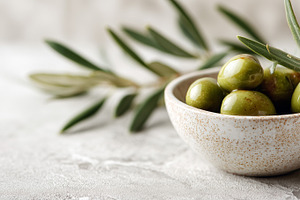 Green olives in a ceramic bowl, a Food & Drink Photo by MistyDay