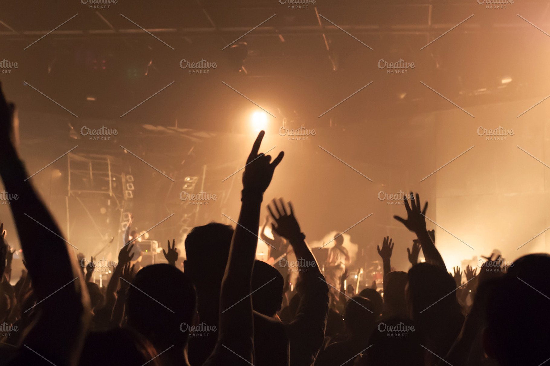 Music band crowds raising hands up in the air (very shallow depth of field), an Arts & Entertainment Photo by Twinster Photo