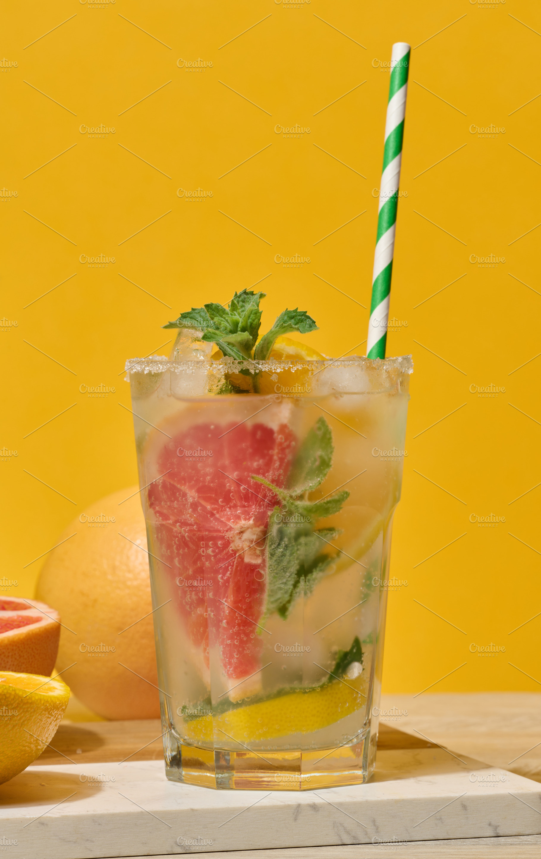 Glass with cool drink garnished with mint, lemon and grapefruit., a Food & Drink Photo by ndanko