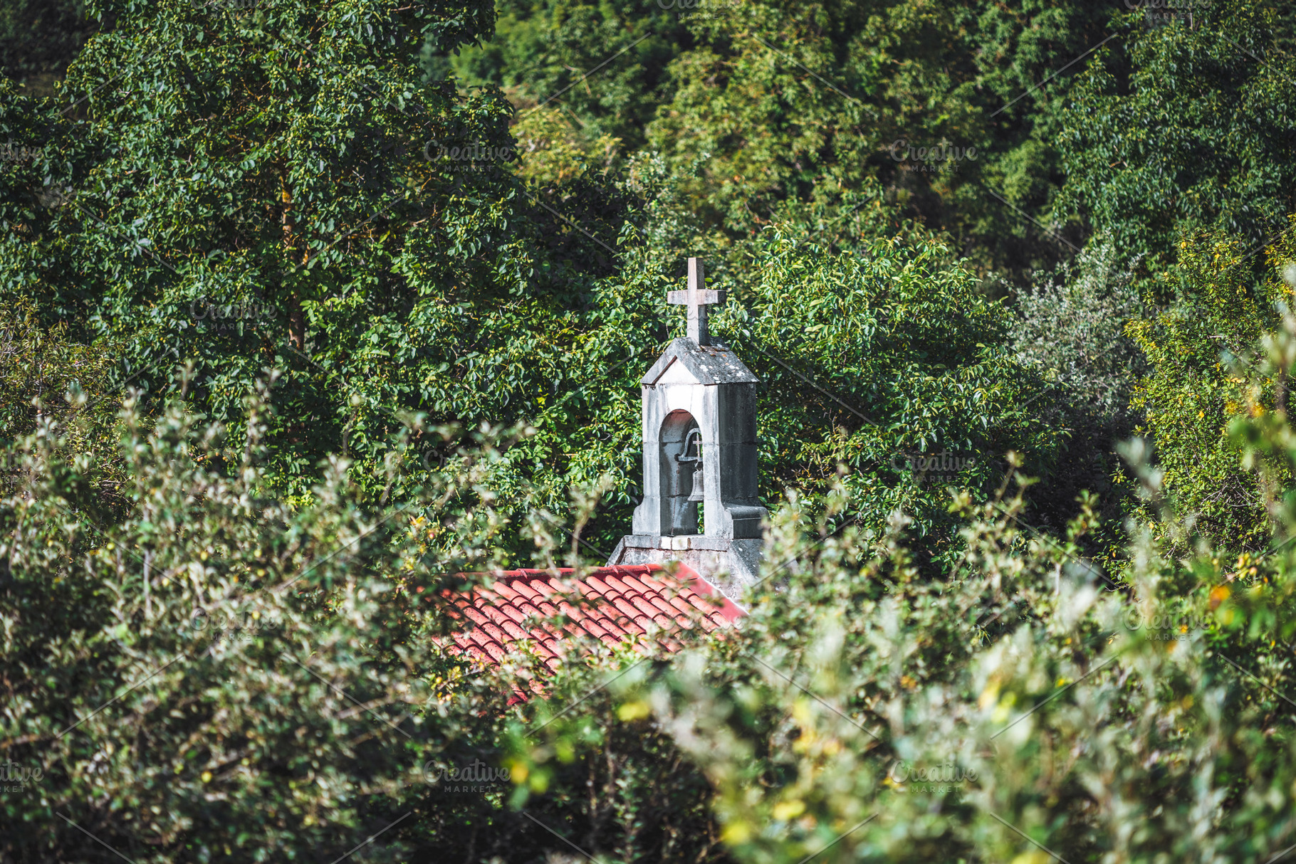 Church bell tower in trees, an Architecture Photo by SkyNext