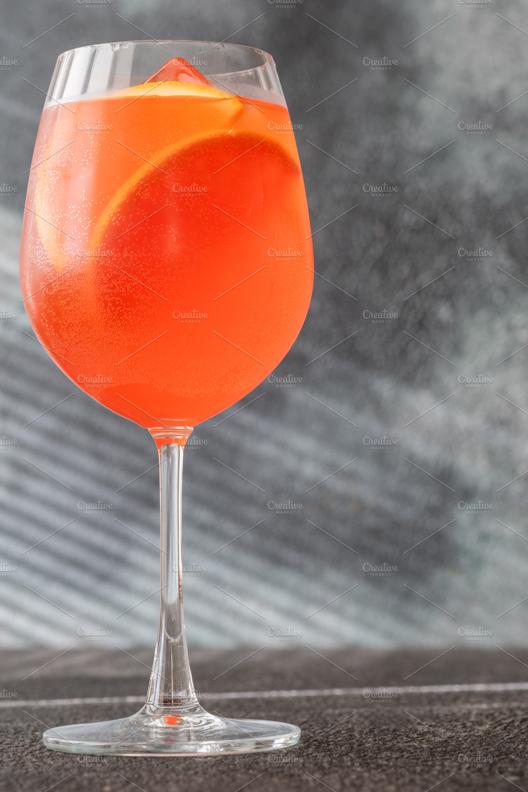 Vibrant Campari Spritz cocktail with citrus ice bubbles elegant, a Food & Drink Photo by Alexander Prokopenko