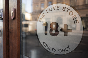 Entrance to an adult store with 18+ sign, a Photo by AS photostudio