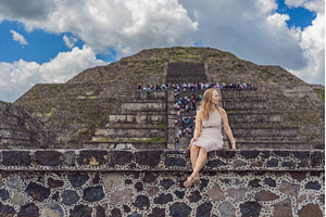 Female tourist standing in front of, an Architecture Photo by Elizaveta Galitskaya