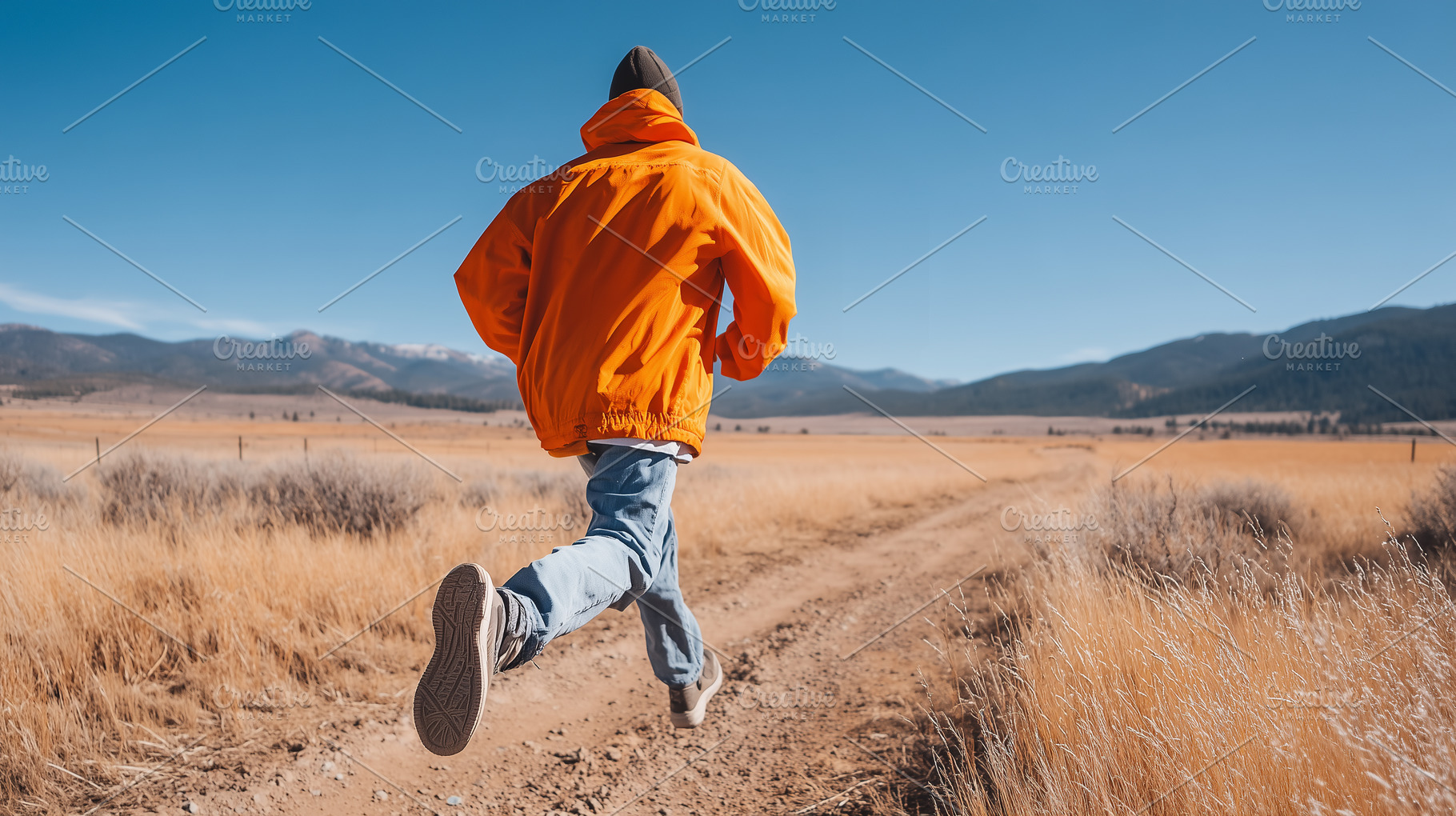 Man in bright orange jacket running, a Sports & Recreation Photo by MistyDay