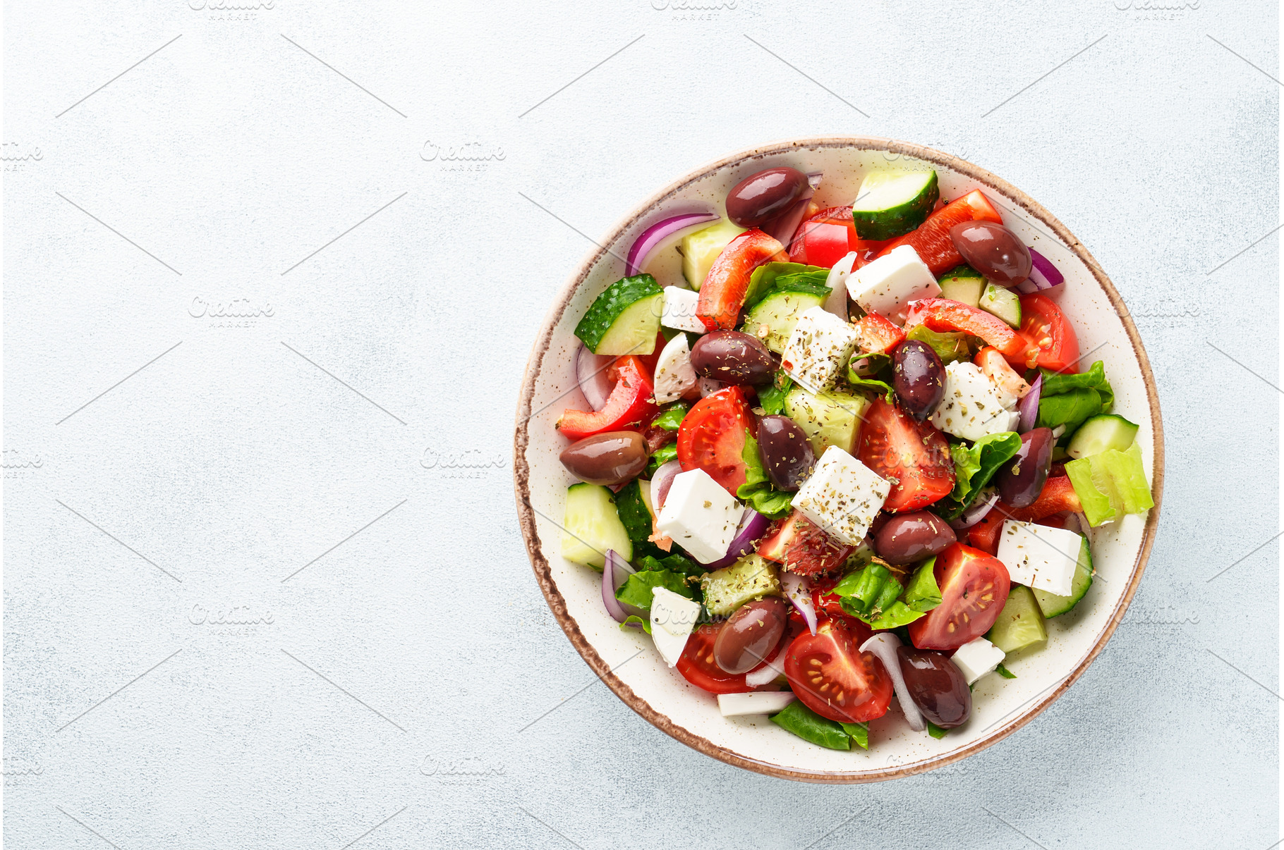 Greek salad in craft plate on white, a Food & Drink Photo by Nadia-nb