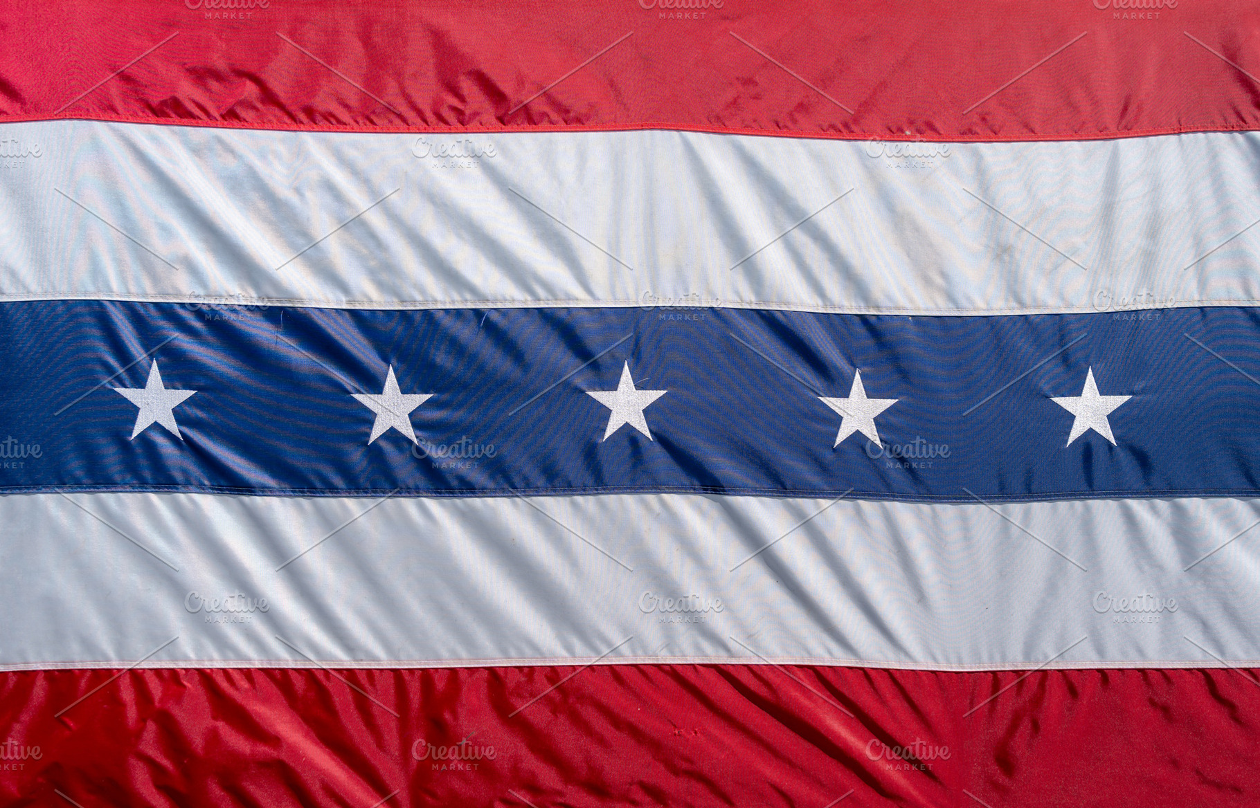 Close-up of a red, white, and blue patriotic flag with stars. US, a Background Photo by GoodGoods