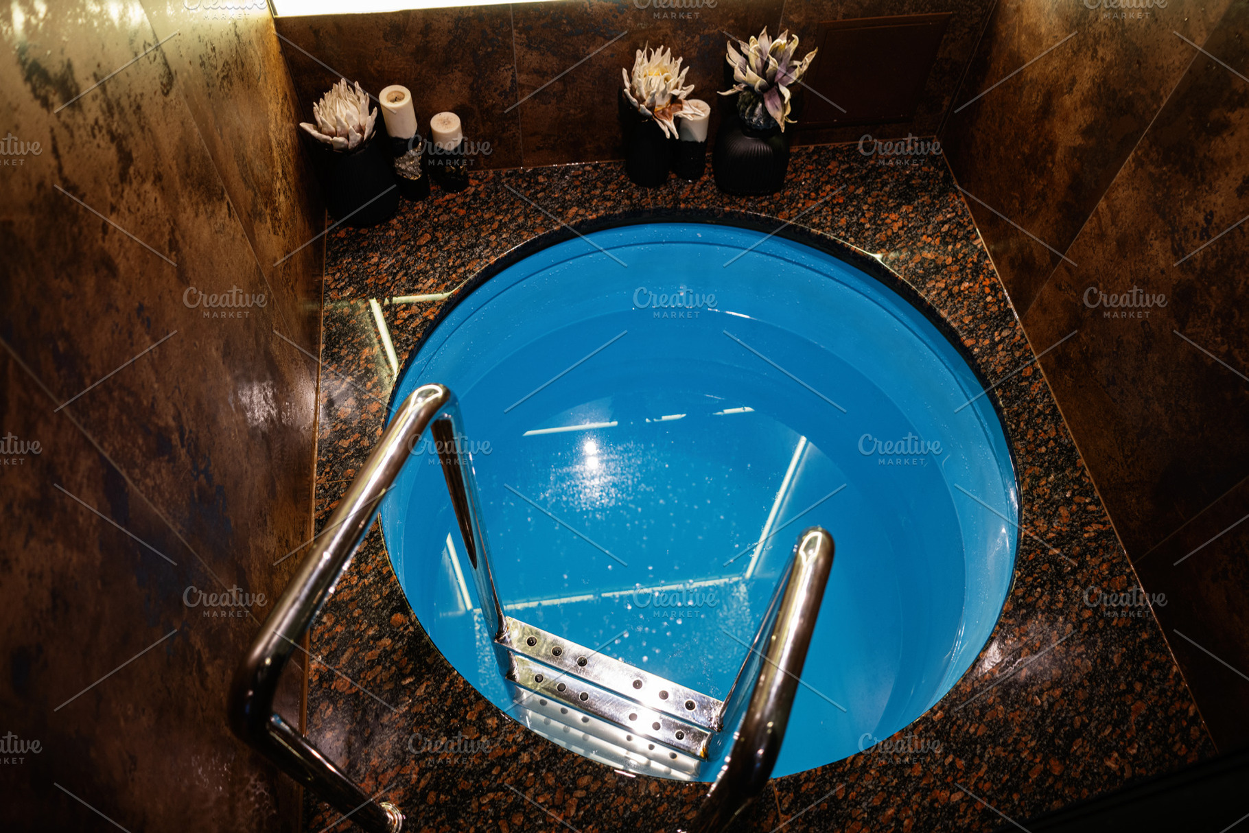 Elegant indoor plunge pool with granite surroundings and modern design, a Photo by AS photostudio