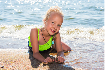 Little girl is laughing and swimming, a Nature Photo by COLORFUL